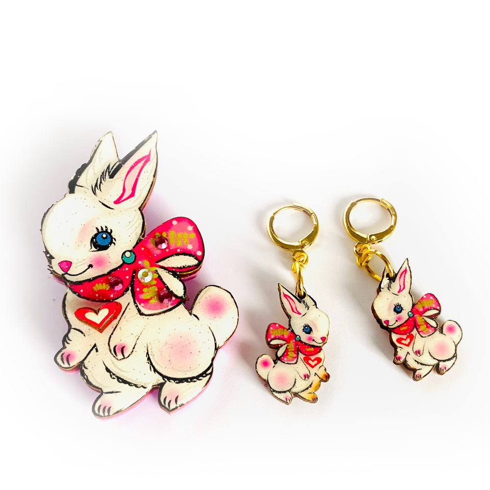 <p>'' Cute Easter rabbit drop earrings featuring Layla the magical little baby Bunny. Beautifully illustrated and incredibly comfy to wear. Brighten up your easter with these special pieces of unusual jewellery. Earrings basics * Measurement 6cm x 6xm * Bunny theme * Miss matched colours * Resin on woods creating a glass affect * Gold plated comfy huggie hoops * </p> <p>Layla the bunny huggie hoop earrings</p>