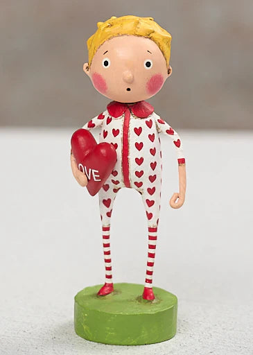 Figurine of a child in pajamas with heart patterns, holding a heart-shaped pillow with 'LOVE' text, on a white background. lori mitchell valentine's day new 2027 figurines