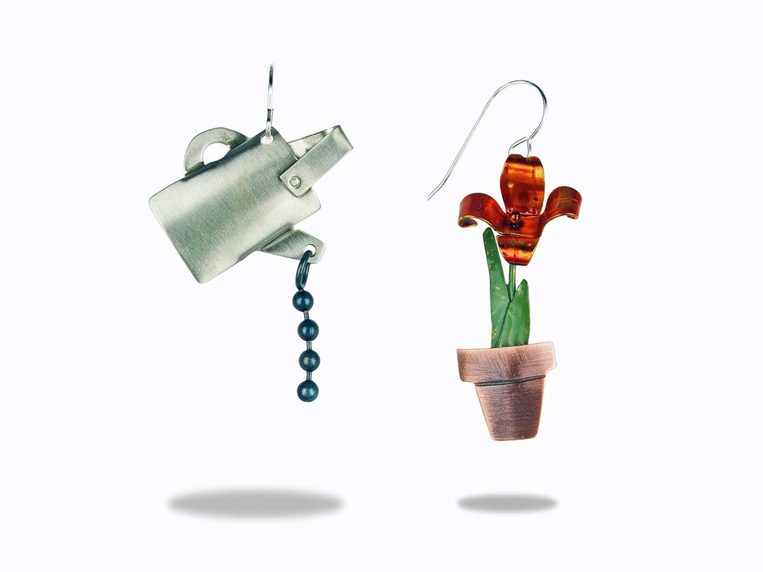 Chickenscratch Watering Can and Flower Mismatched Earrings — handmade brushed nickel silver watering can with brass bead chain water and articulated brass enamel flower in copper pot, sterling silver ear wires