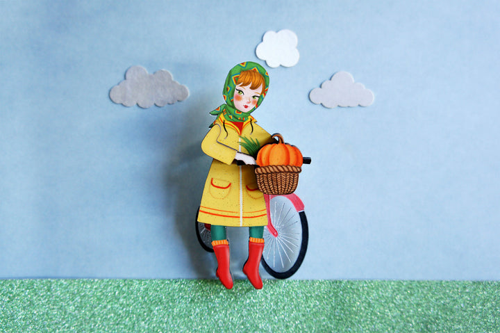 Girl with bicycle brooch by Laliblue