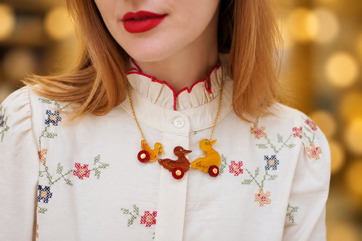 Ducks on wheels necklace detail, LaliBlue Christmas jewelry, ducks, toy