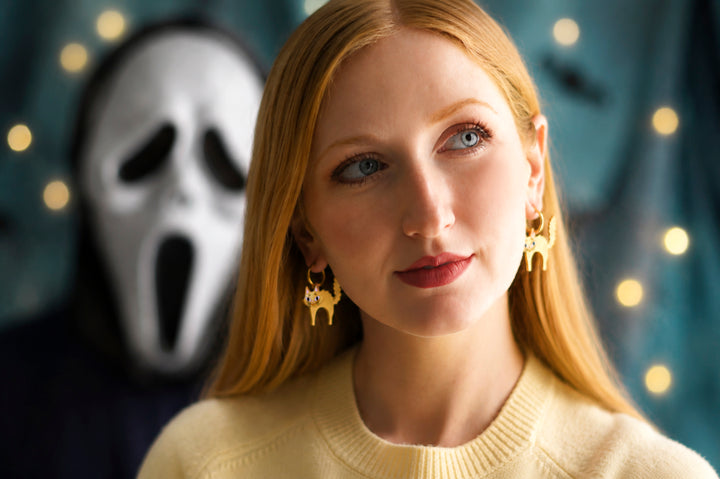 Scared Halloween cat earrings close-up — laser cut acrylic jewelry — LaliBlue Midnight Cinema