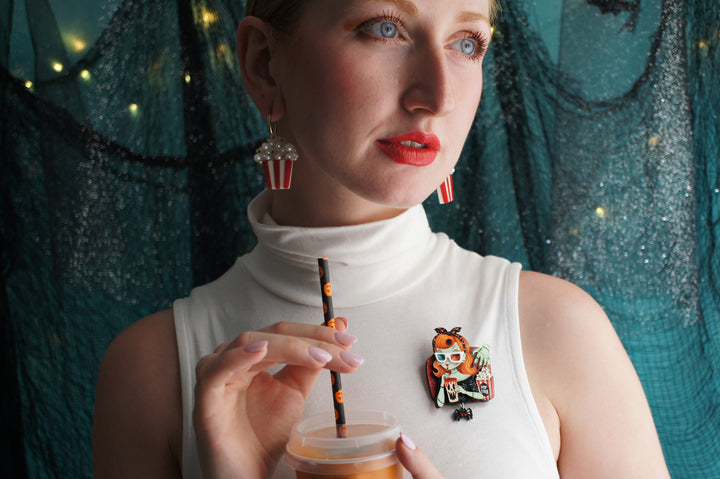 Zombie girl brooch detail — cinema viewer with popcorn and spider — Halloween acrylic glitter jewelry — LaliBlue Midnight Cinema