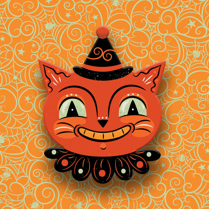Halloween-themed cat face decoration with a witch hat on an orange patterned background Johanna Parker cat halloween