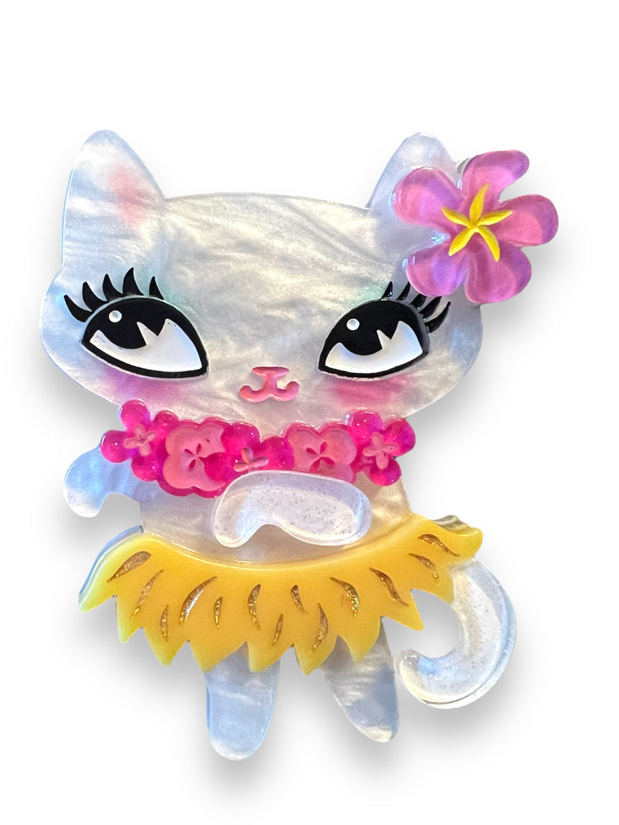 This playful Tiki Hula Kitty Brooch by Miss Fluff x Lipstick &amp; Chrome is crafted from lightweight laser-cut jelly resin acrylic, with engraved and painted accents for a touch of playful sophistication. Designed by Miss Fluff and brought to life by Lipstick &amp; Chrome, it's the purr-fect accessory for any outfit! 😻  Our&nbsp;brooches are meant to remind you of the charm and personality of vintage&nbsp;jewelry.