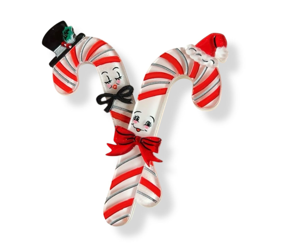 Candy Cane Couple holiday brooch — two candy canes with blushing faces, top hat and Santa cap, glitter and jelly resins, red rhinestones