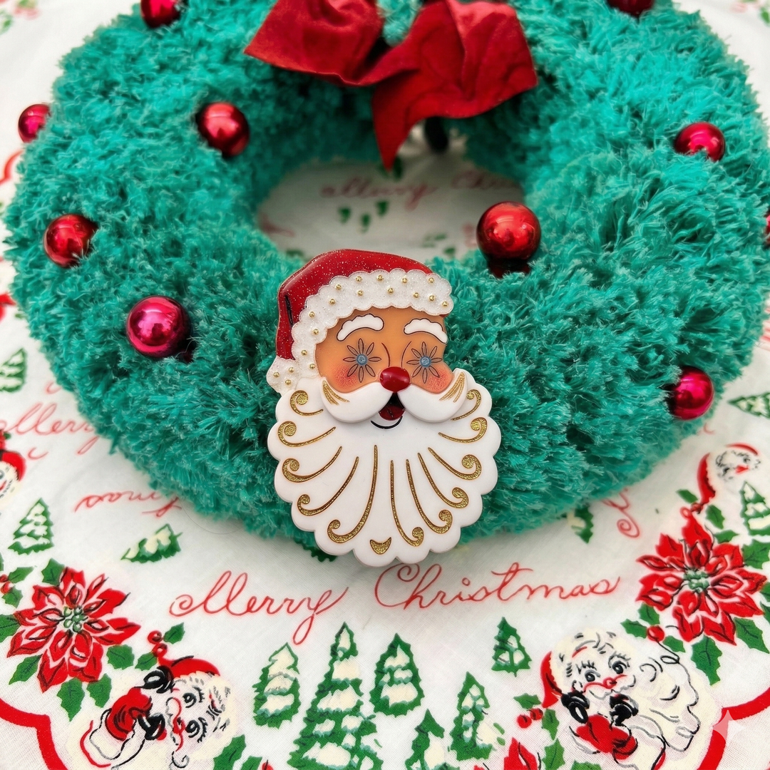 Christmas wreath with starry eyed holt howard Santa face decoration on a festive background