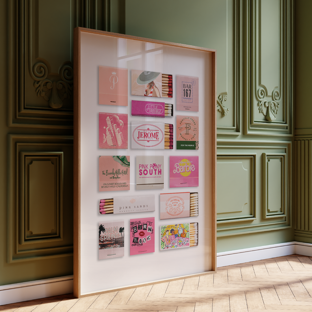 Collection of vintage matchbooks displayed in a frame against a decorative wall.