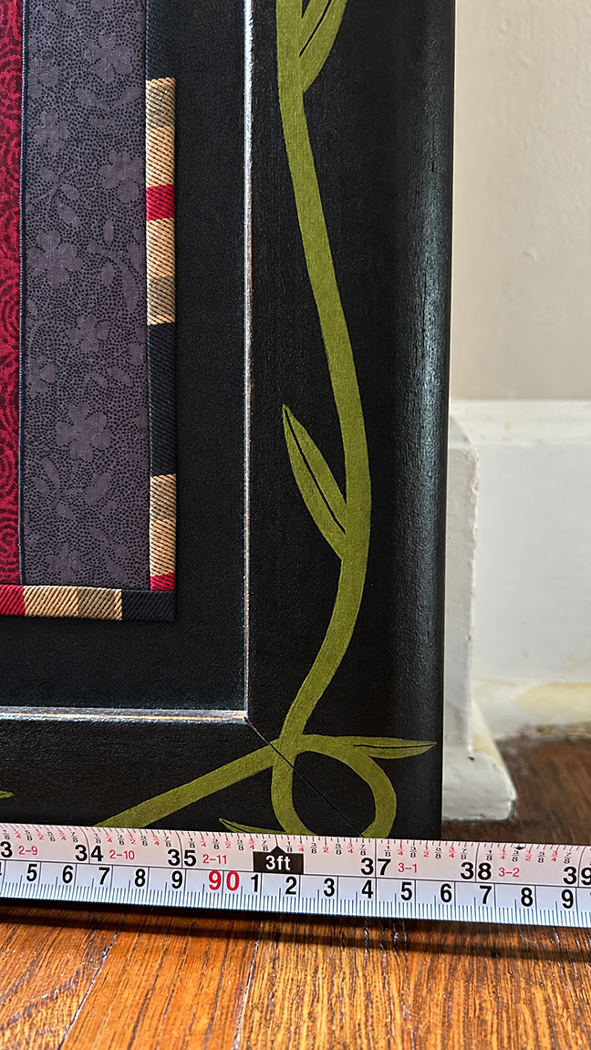 Tape measure showing Chris Roberts-Antieau Ten Table Manners framed width of about 38.5 inches