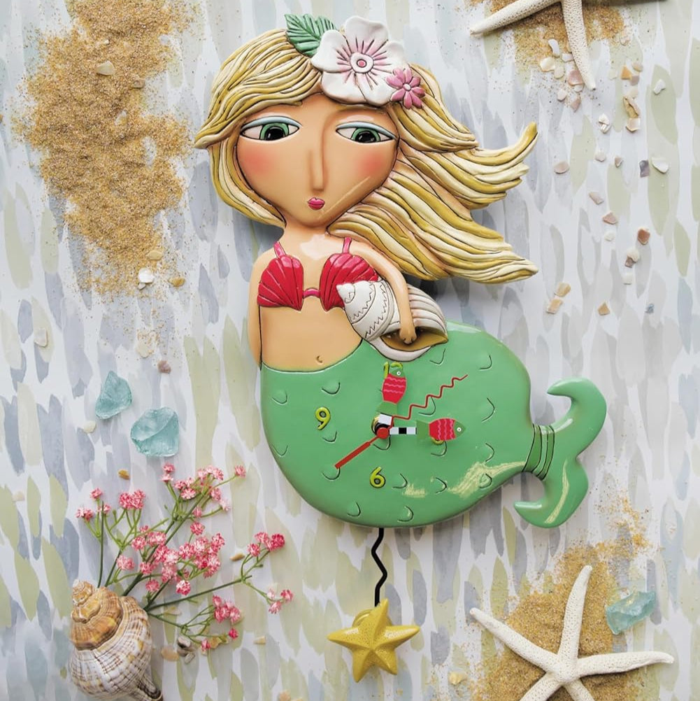 Decorative mermaid wall clock with beach-themed decorations on a textured background