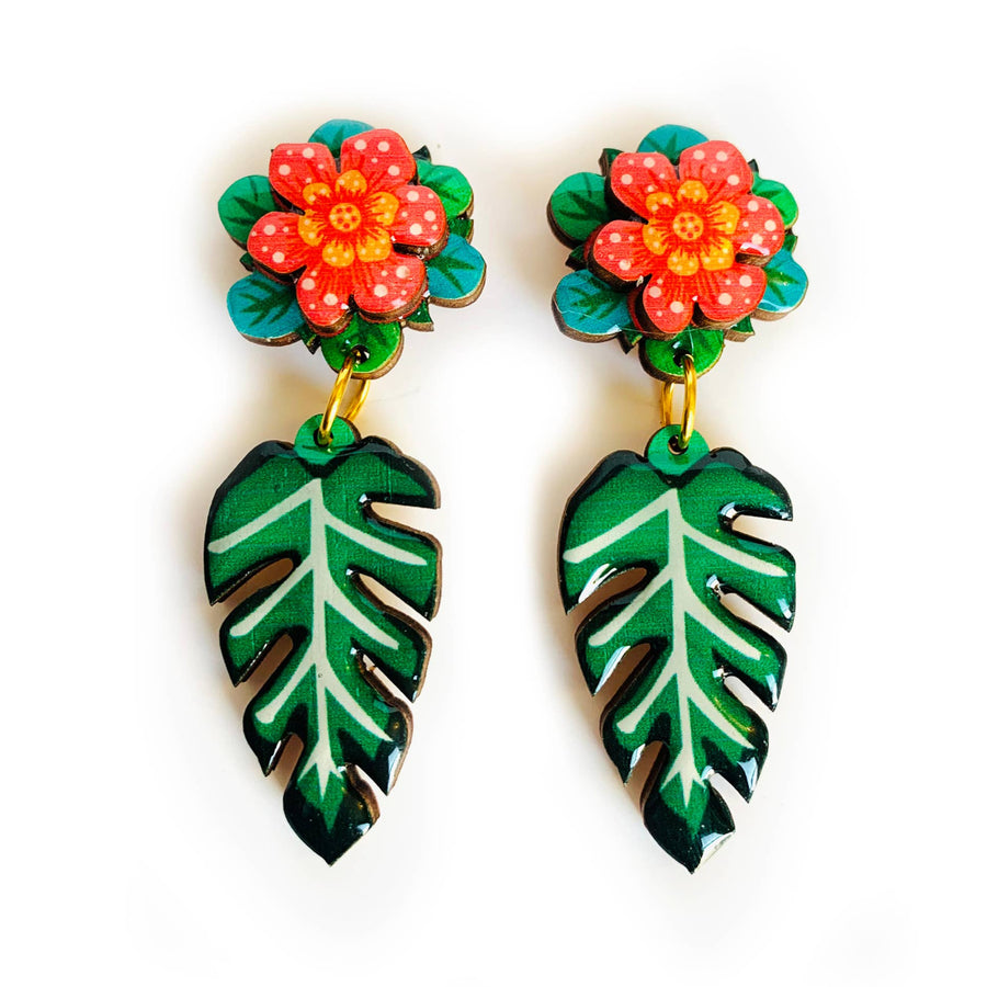 'Tropical flower leaf earrings' Check out these AMAZING tropical flower earrings - super funky pretty and very unusual. Created and illustrated inhouse with a glorious tropical 3D flower and drop leaf. You wont find another pair of earrings like these! Super for your summer style outfits! Earrings basics * Measurements - 6cm x 3cm * 3D Flower design. * Laser cut and finished with glass resin and pretty gem * Hypoallergenic back for safety and hygiene. * 100% handmade and designed. * Unusual design with a mi