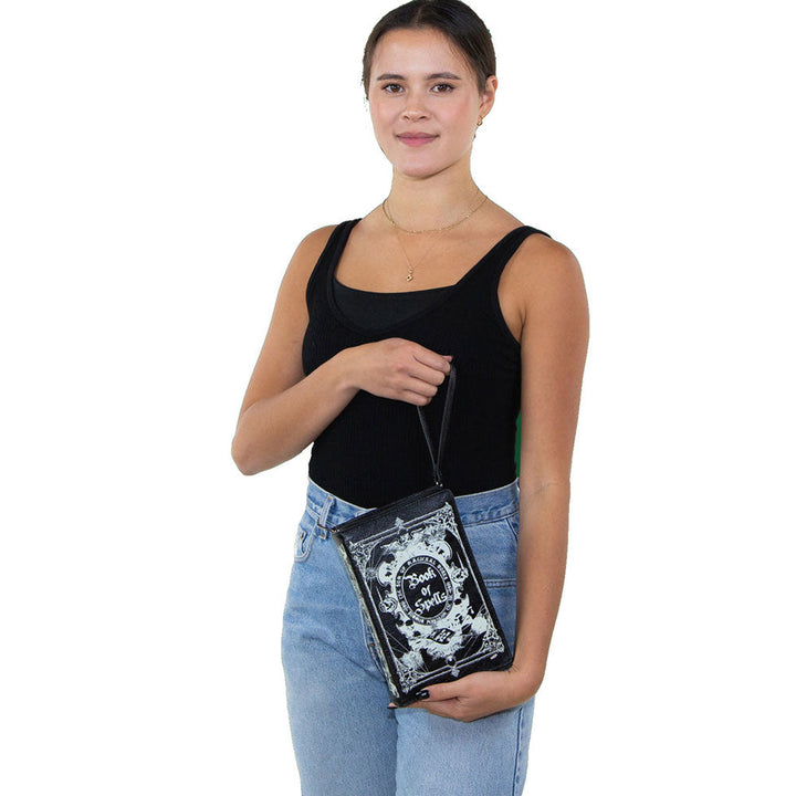 Glow In The Dark Book Of Spells Crossbody Bag In Vinyl Material by Book Bags