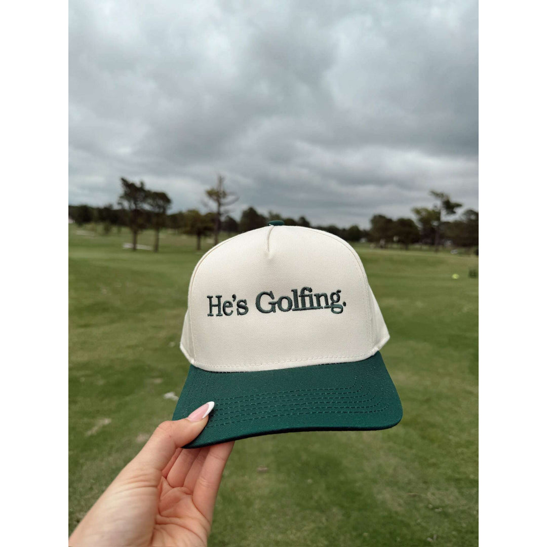 He's Golfing - Green Vintage Trucker Hat