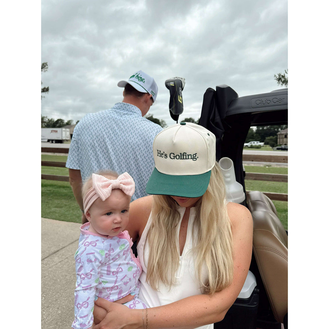 He's Golfing - Green Vintage Trucker Hat