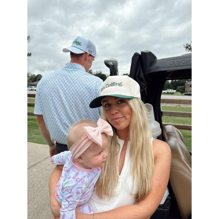 He's Golfing - Green Vintage Trucker Hat