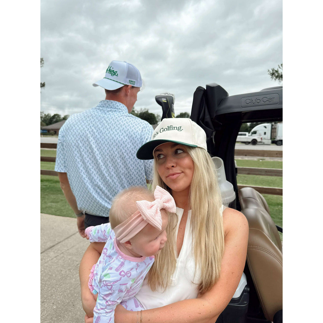He's Golfing - Green Vintage Trucker Hat