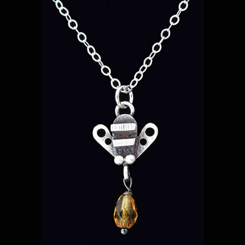 Chickenscratch Honey Bee Necklace detail — artisan sterling silver bee pendant with glass honey drop handmade in USA