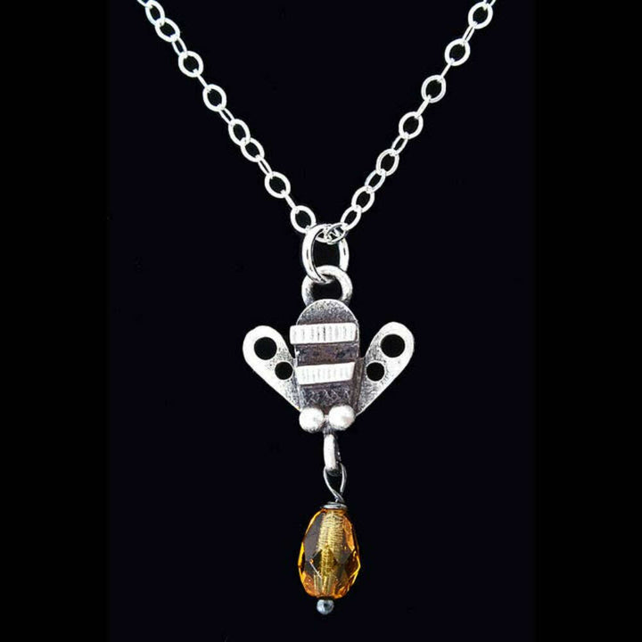 Chickenscratch Honey Bee Necklace detail — artisan sterling silver bee pendant with glass honey drop handmade in USA