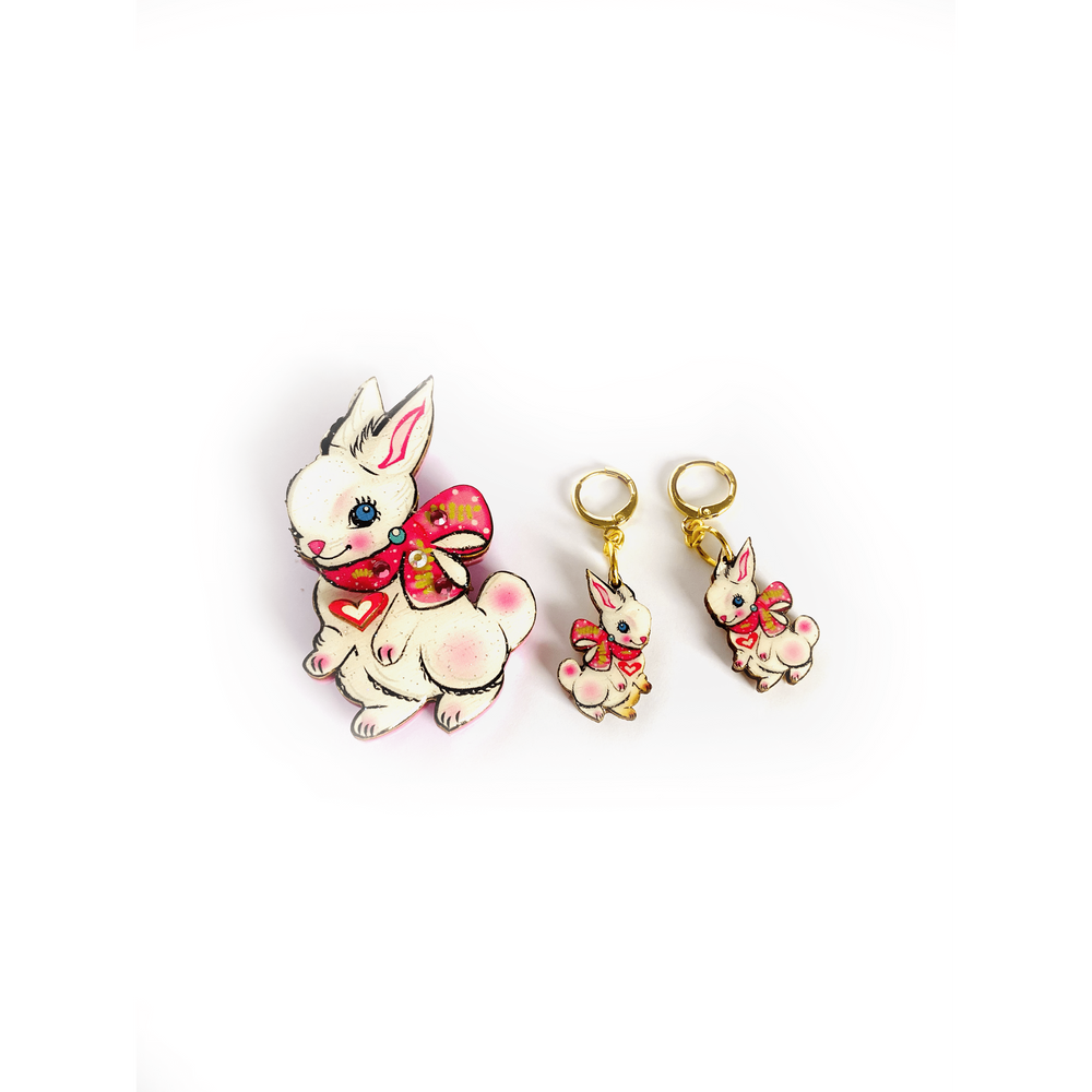 'Layla the magical bunny brooch' Welcome the lovely little Layla bunny brooch! Shes so magical and adorable with the little heart and prety scarf. Perfect for easter. Brooch basics * measurements 7cm x 5cm. * Certified woods/lasercut. * Stainless steel brooch back * Illustrated inhouse. * Resin cured. * Pastel * Perfect for spring * Bunny theme.. great easter gift!