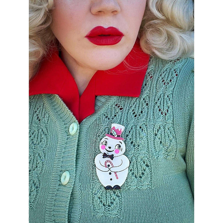 Johanna Parker x Lipstick & Chrome snowman brooch styled on coat — Love at Frost Sight