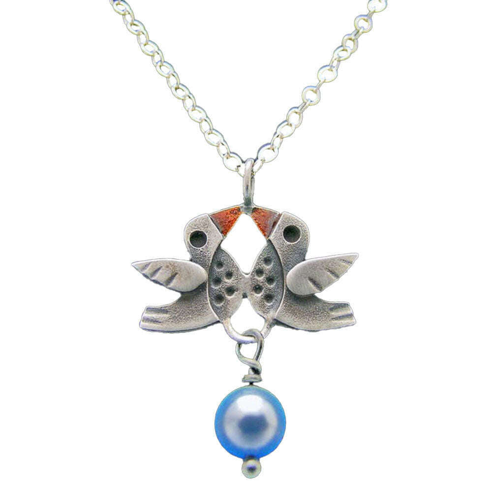 Chickenscratch Lovebirds Necklace — cast sterling silver double bird charm necklace with orange enamel accents and blue glass pearl dangle on 18-inch sterling silver chain