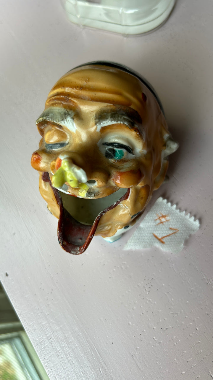 Old man ashtray detail view