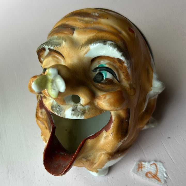 Old man ashtray angle view