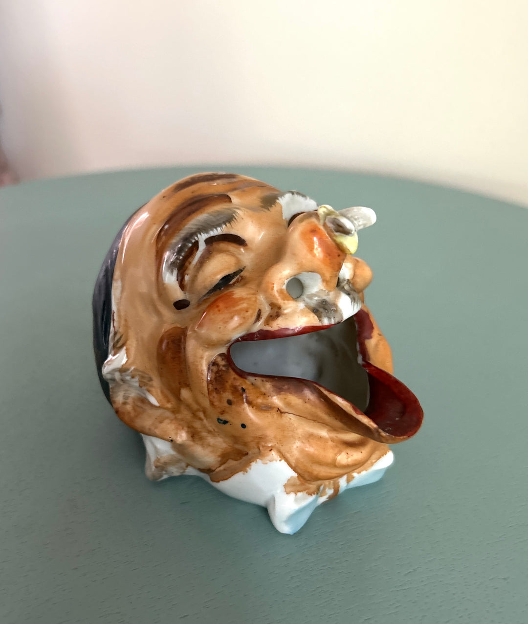 Old man ashtray detail view