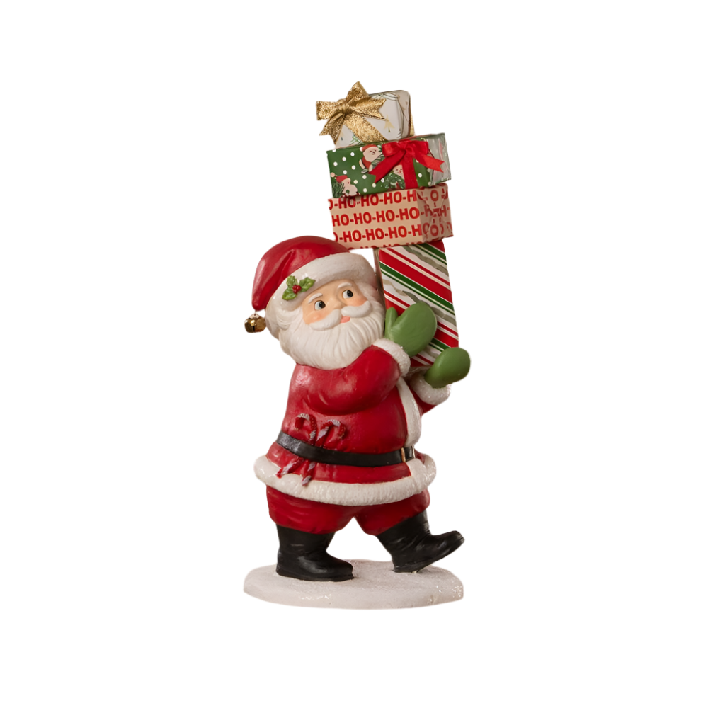 Santa Claus figurine holding a Christmas stocking with presents on a white background