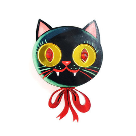 This brooch is inspired by the helium balloons at fairs.

 Meow! Adorable and funny

-Made of illustrated wood

 -Details in mirror-effect acrylic and red pearlescent

 -Red rhinestones in the eyes

 -Safety pin with safety closure on the back

 -Size: 5.5 x 3.5 cm


 Original illustration and design by LaliBlue. 