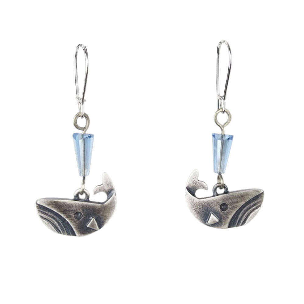 Chickenscratch Whale Earrings — cast sterling silver whale charms with faceted fumed blue glass bead spout, locking sterling silver ear wires